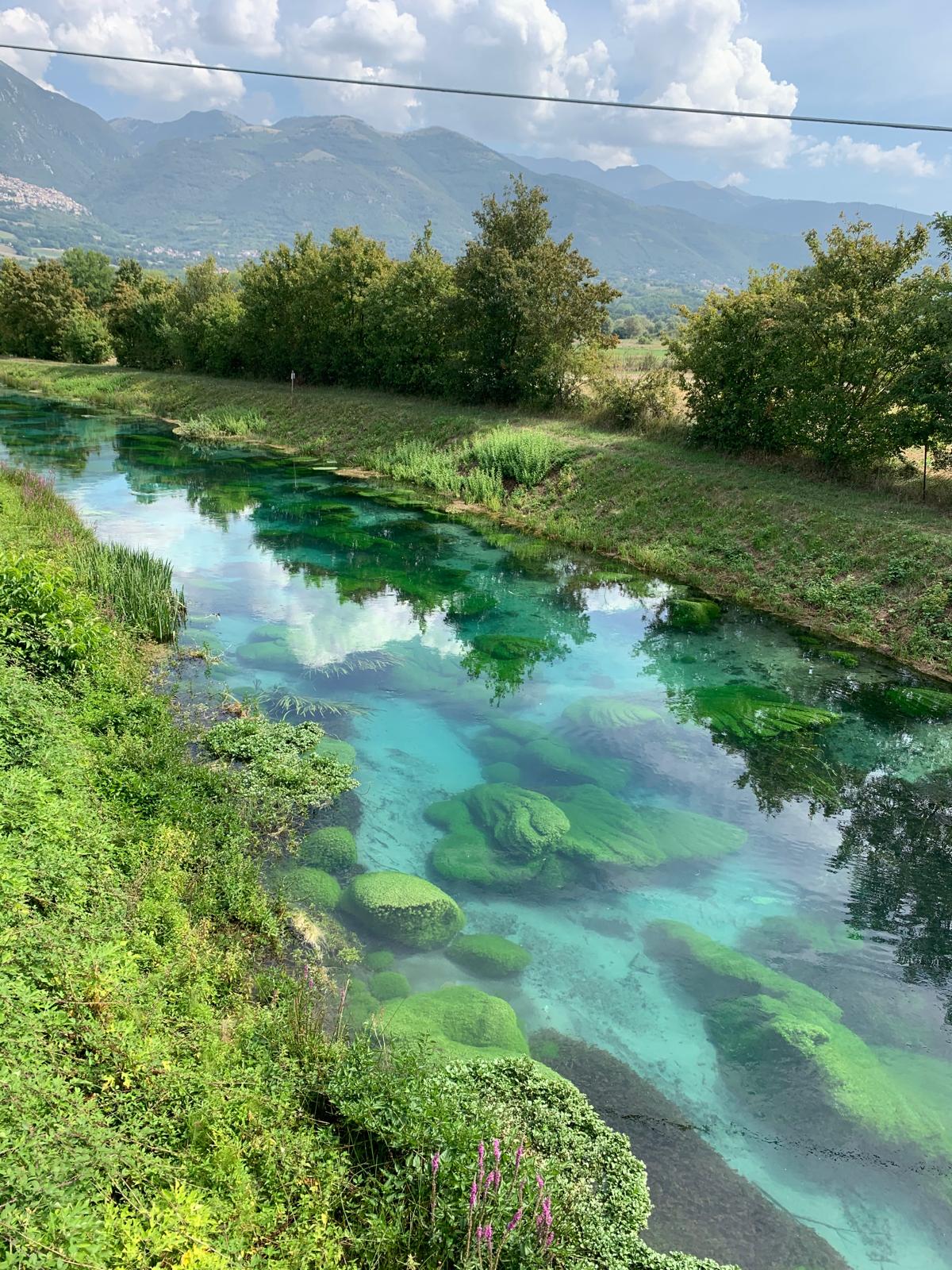 Angler fly fishing the clear Santa Susanna chalk stream near Rome