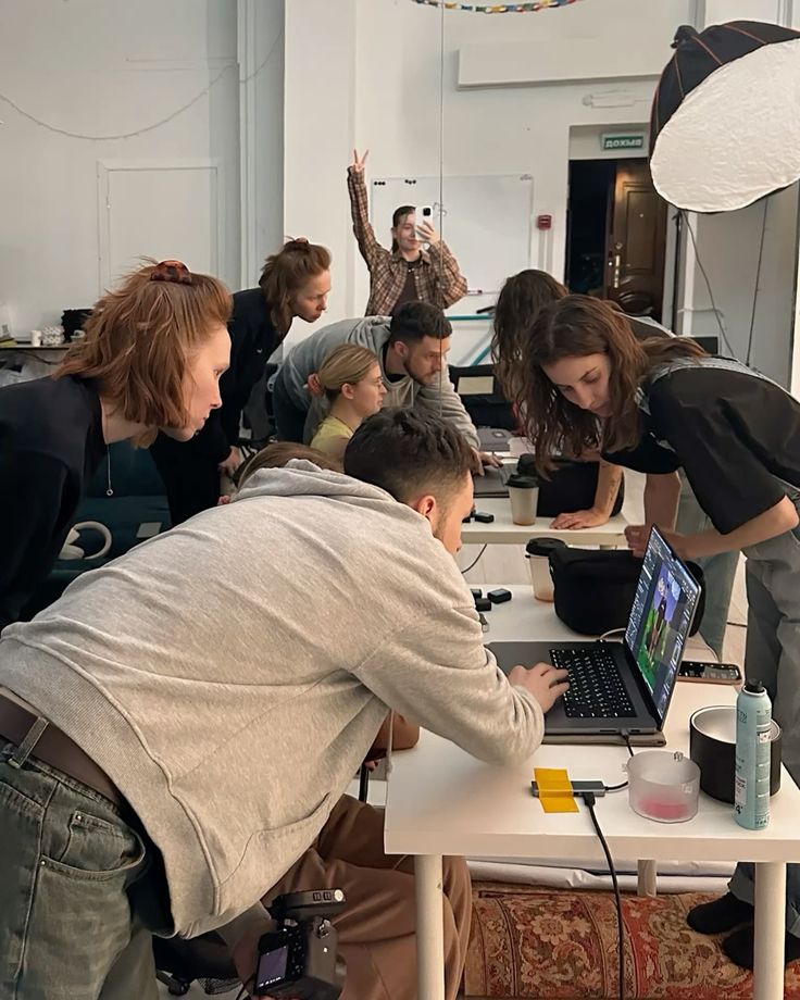 a man in a suit looking at his cell phone