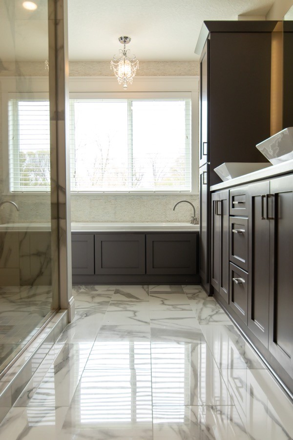 New bathroom large tile dark wood cabinets