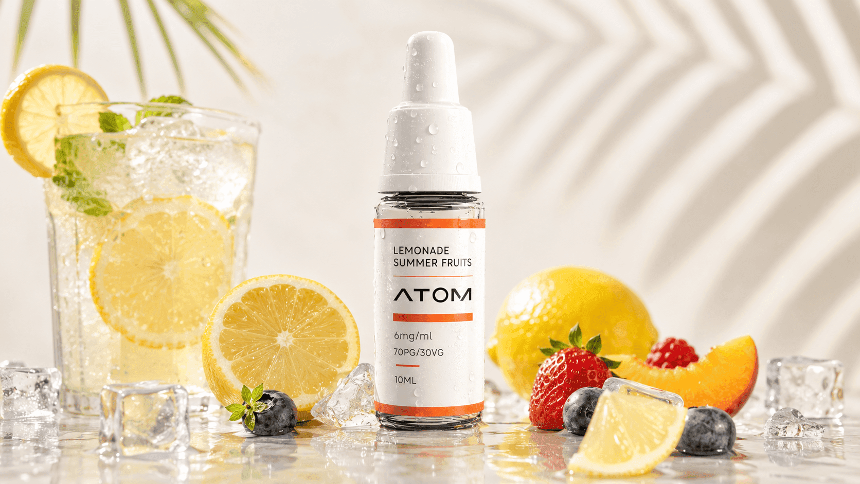 ATOM Lemonade Summer Fruits e-liquid bottle with chilled lemonade, lemon slices and mixed summer fruits.