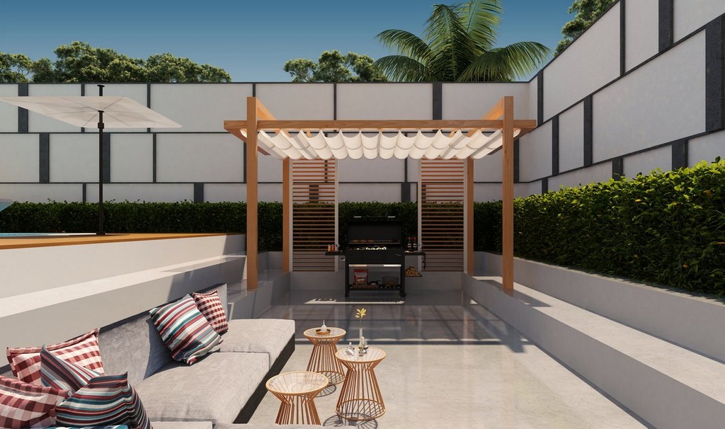 Contemporary outdoor patio at Vue Doree Crystal Bay, showcasing a pool surrounded by elegant furniture for leisure.
