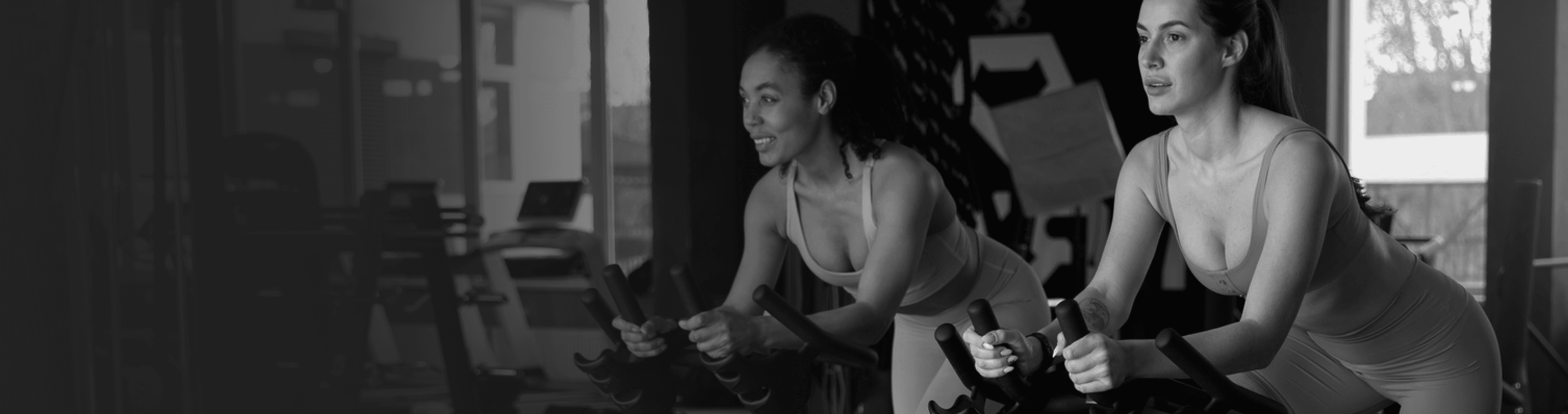 Athletic woman training cardio on indoor bike