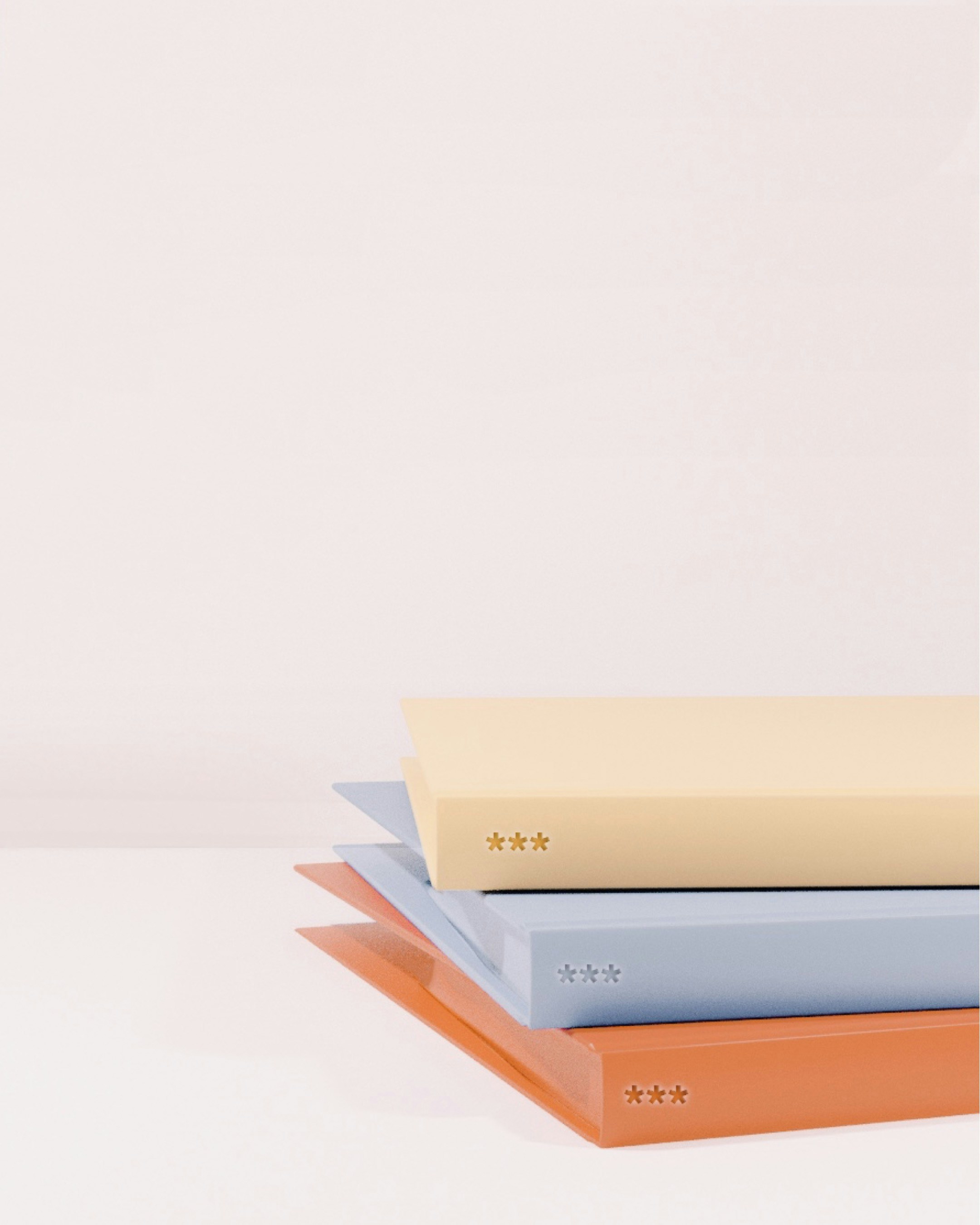 stack-of-books-on-white-table - agnivesh-jayadeep (unsplash)./pho