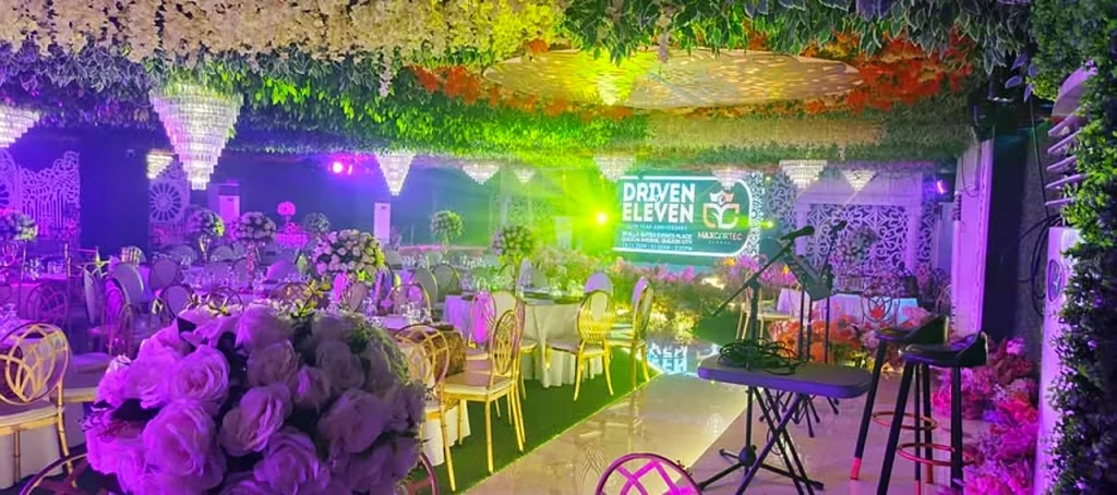 Company party with vivid stage lighting at Pandora Hall, Stalla Suites QC