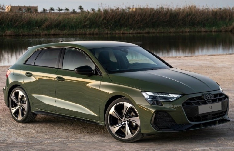 orange coupe parked near white and gray building
