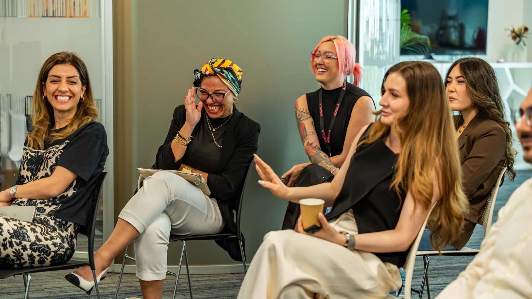 Palm trees frame a dramatic mountain valley landscape