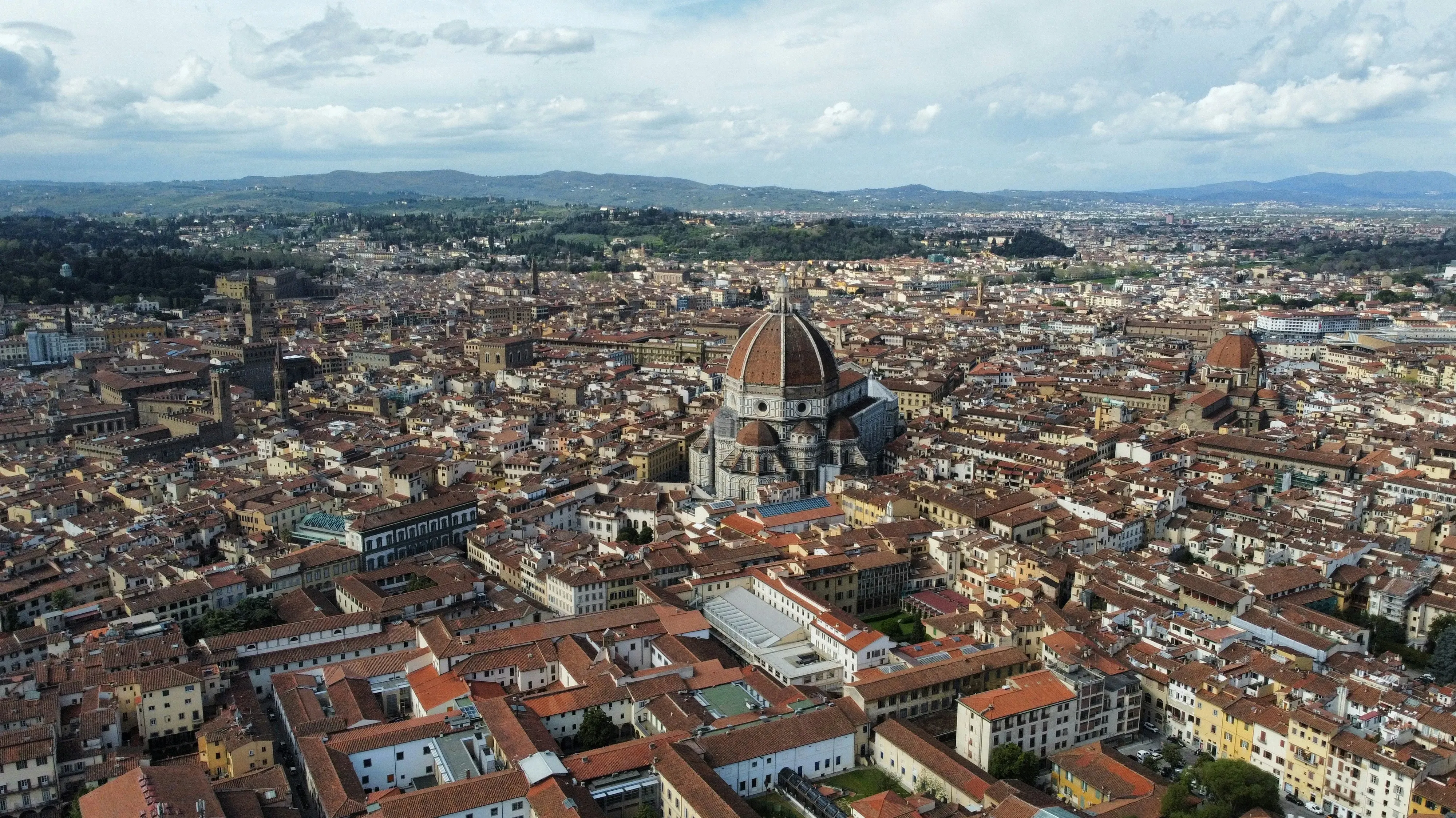An aerial view of a city with tall buildings