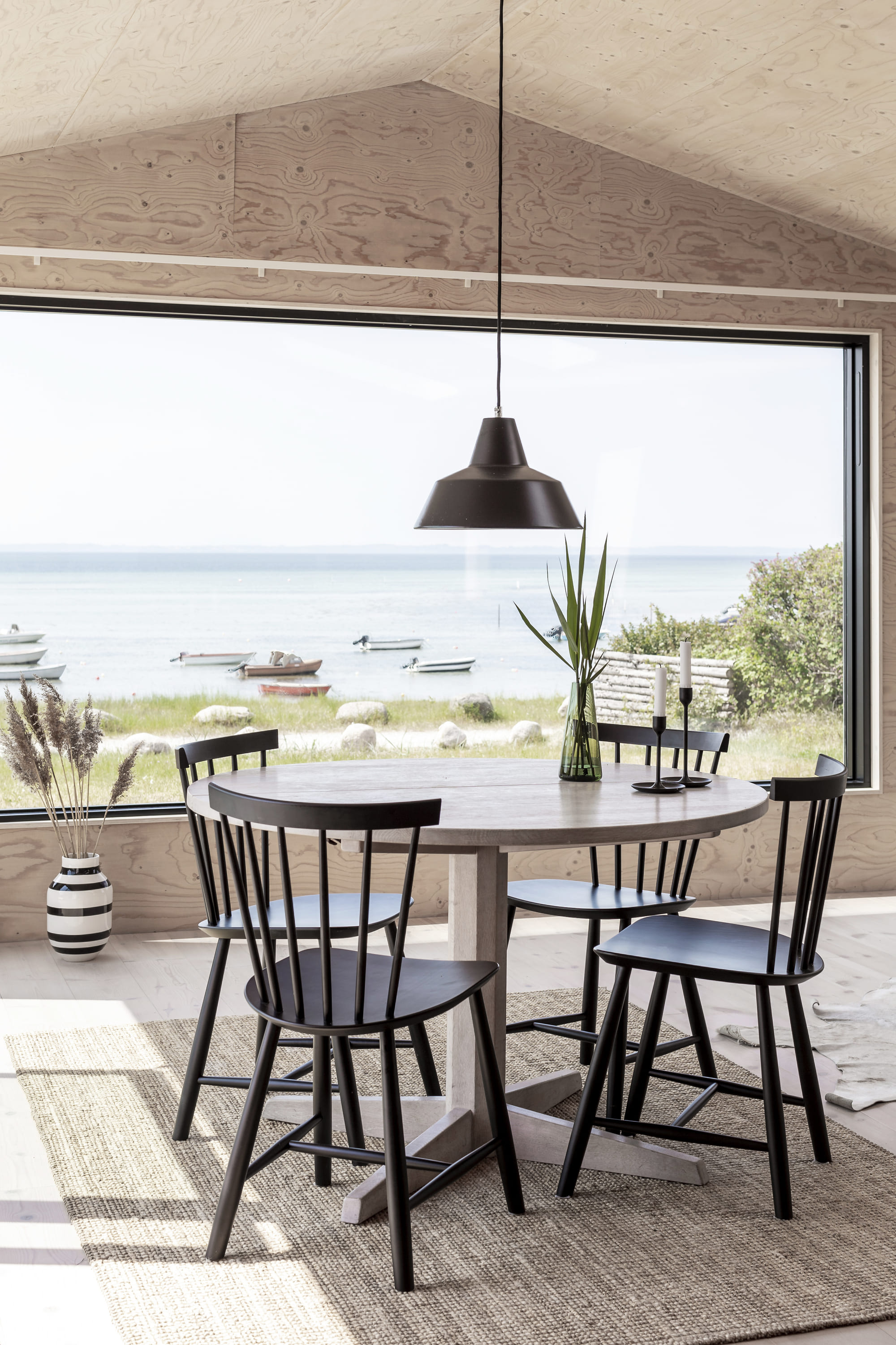 Metal Table standing aganst a wood wall