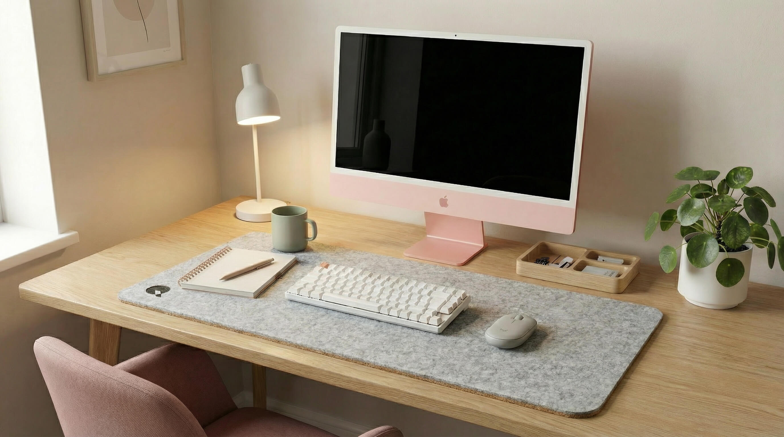 Light grey premium felt desk pad in a minimal workspace with pink iMac