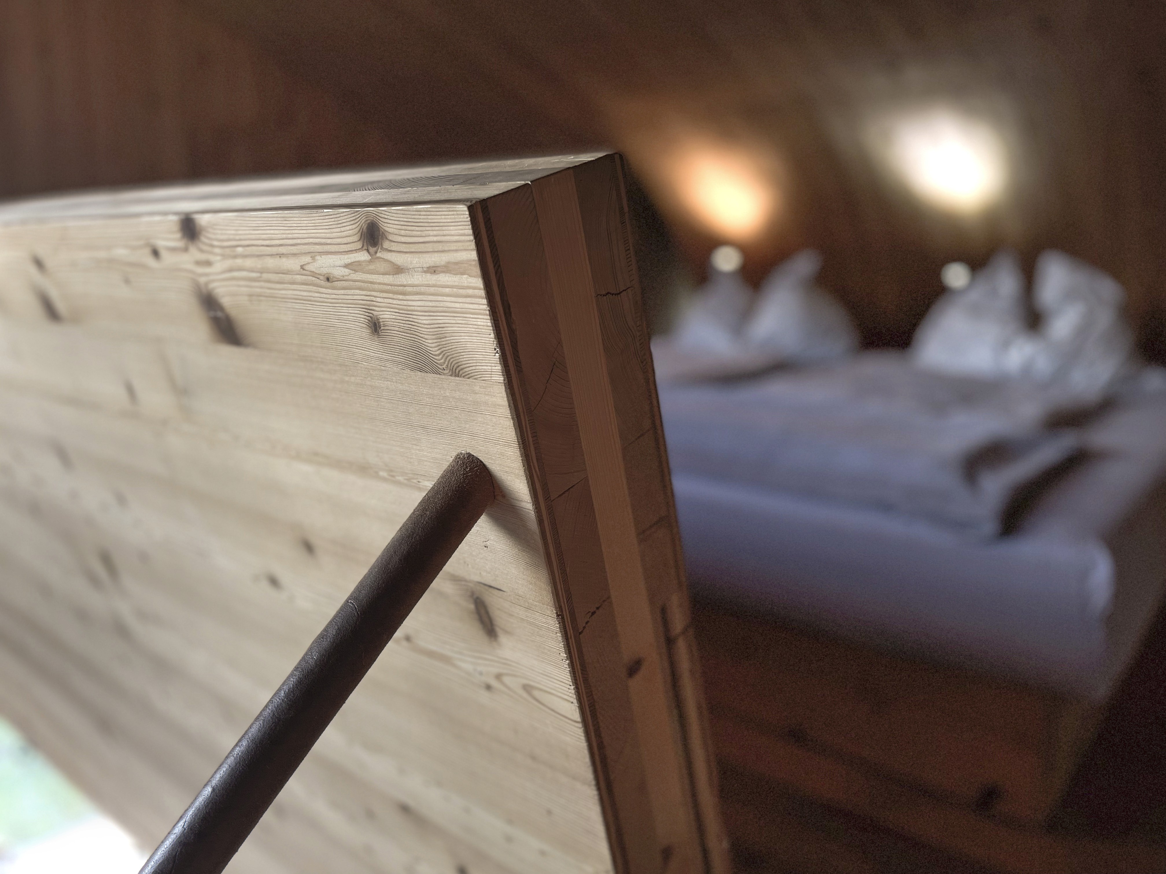 Detail of Ufogel’s handcrafted timber interior leading to the mezzanine sleeping area