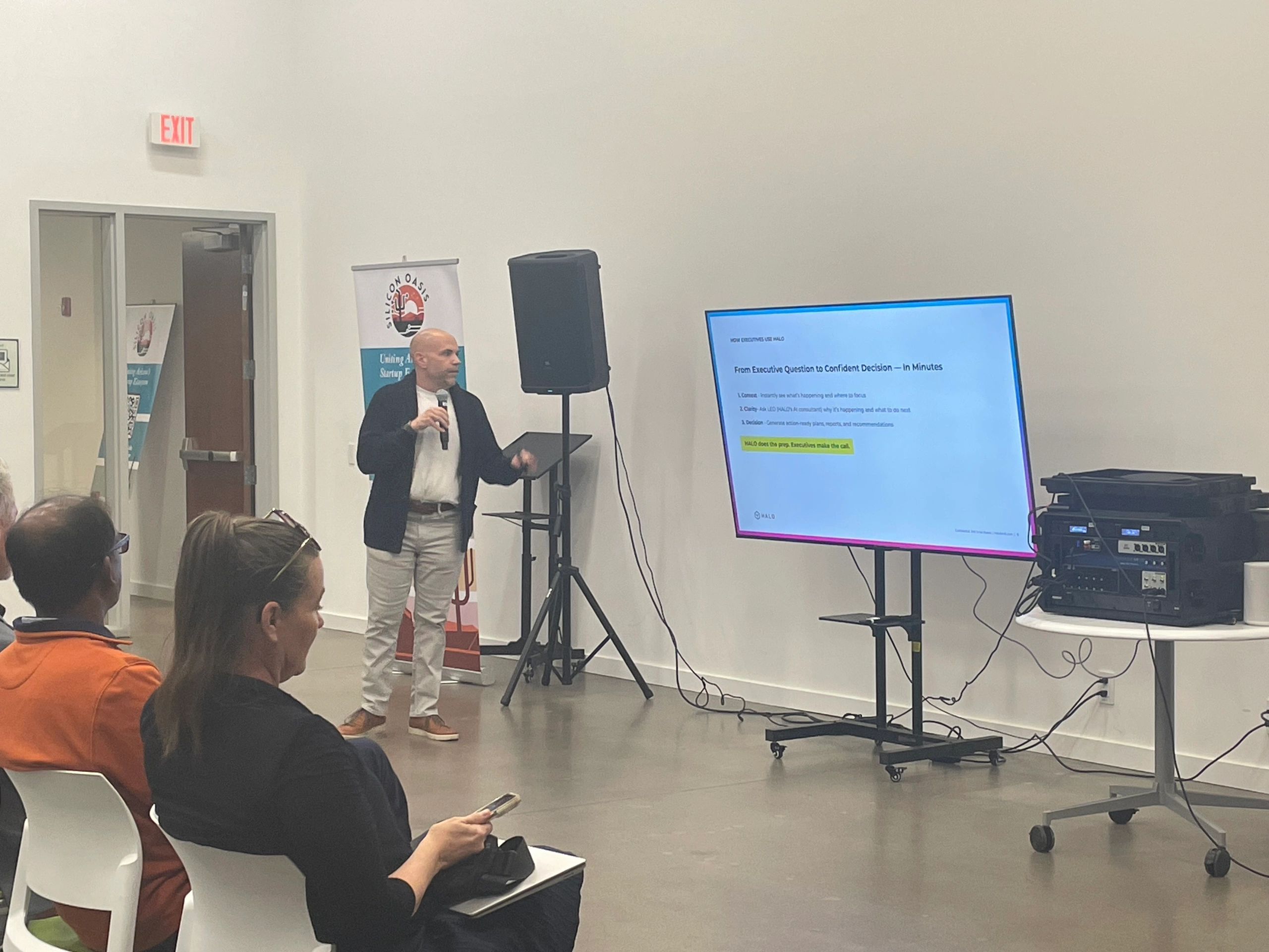 a black and white living room with a large tv