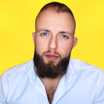 A woman with a red bow headband and bright orange and blue clothing poses against a teal and orange geometric background. Her expression is confident.