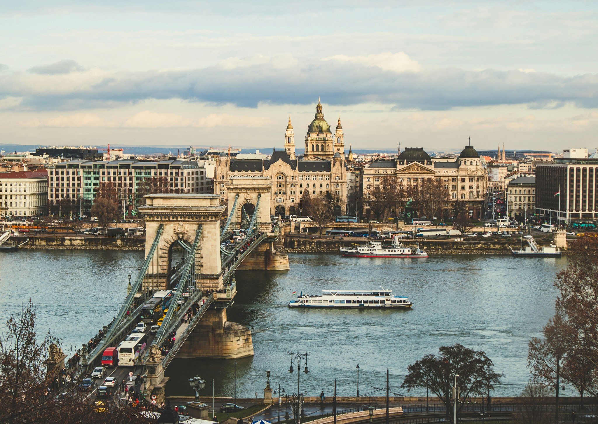 bridge over body of water in front of buildings