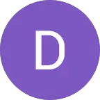 A person in a white shirt black coat with the fair skin looking infront