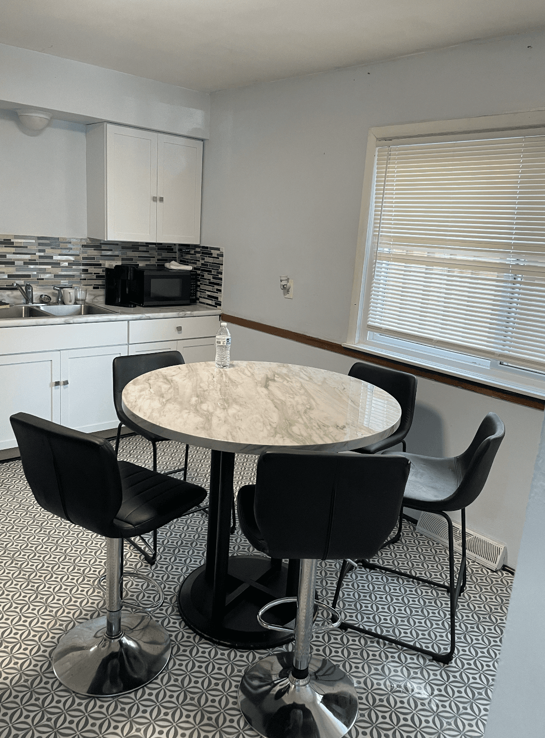 white and brown concrete building near green grass field during daytime