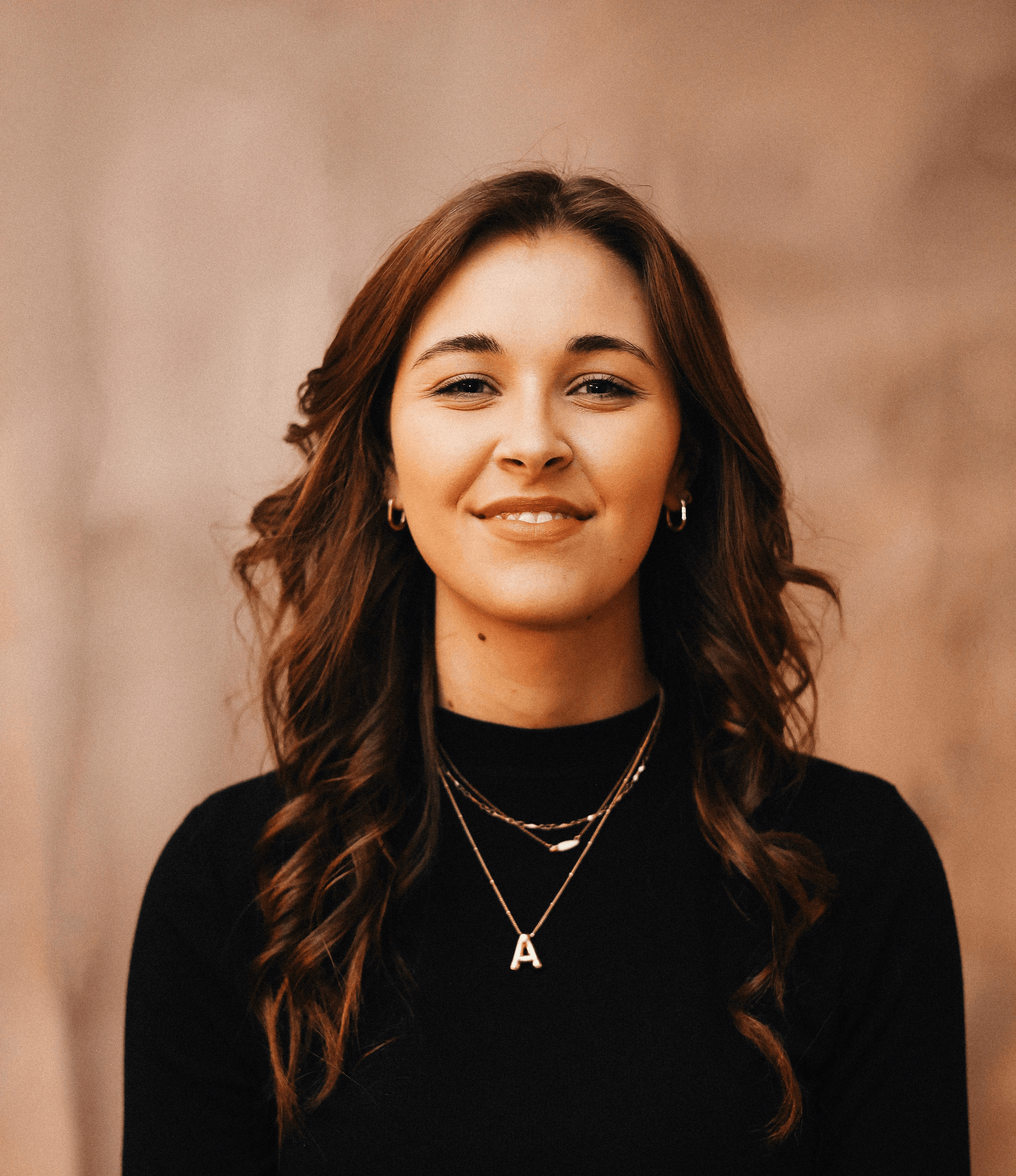 A smiling woman poses for a portrait.