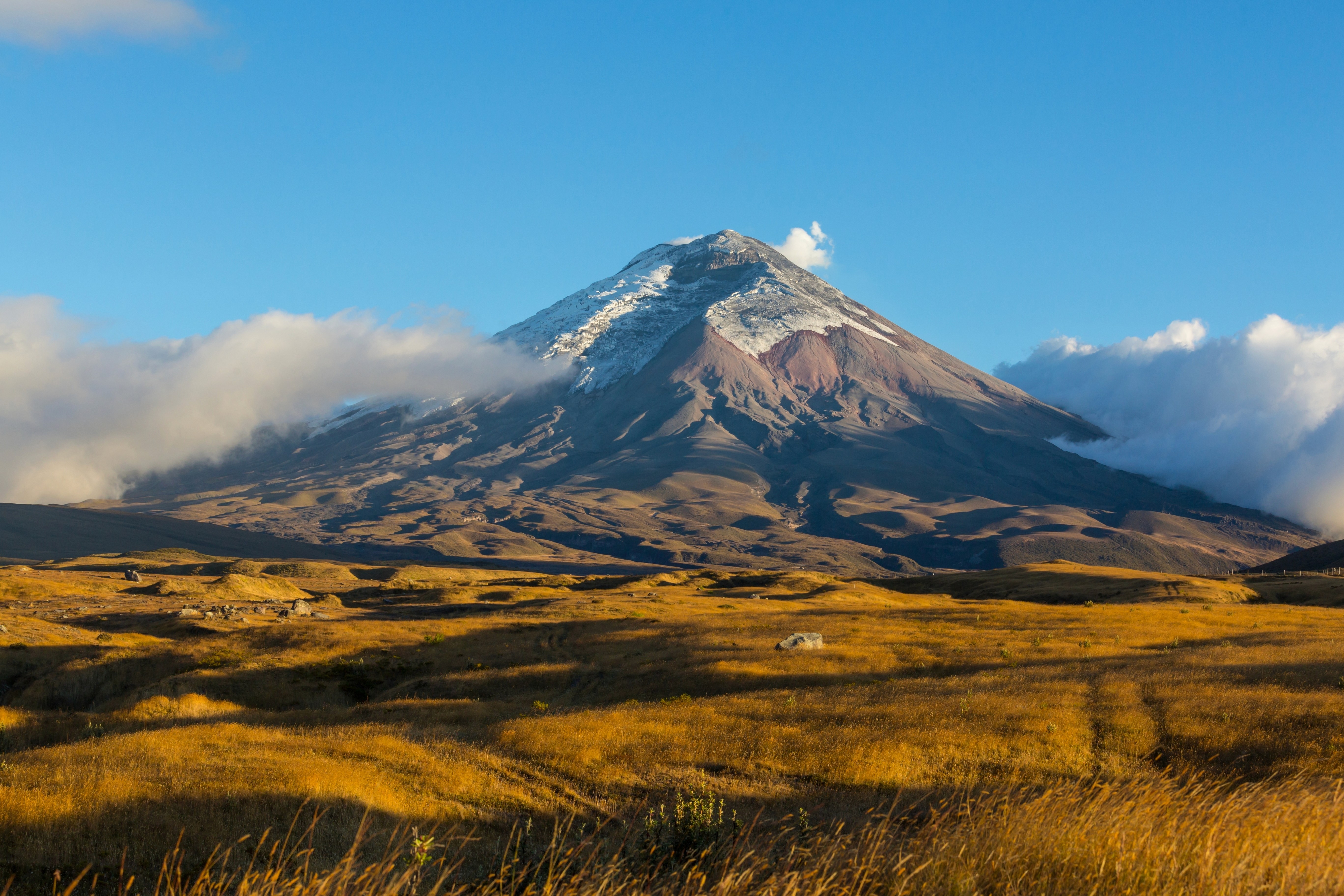 An image of Cotopaxi volcano, whose peak is higher than the clouds