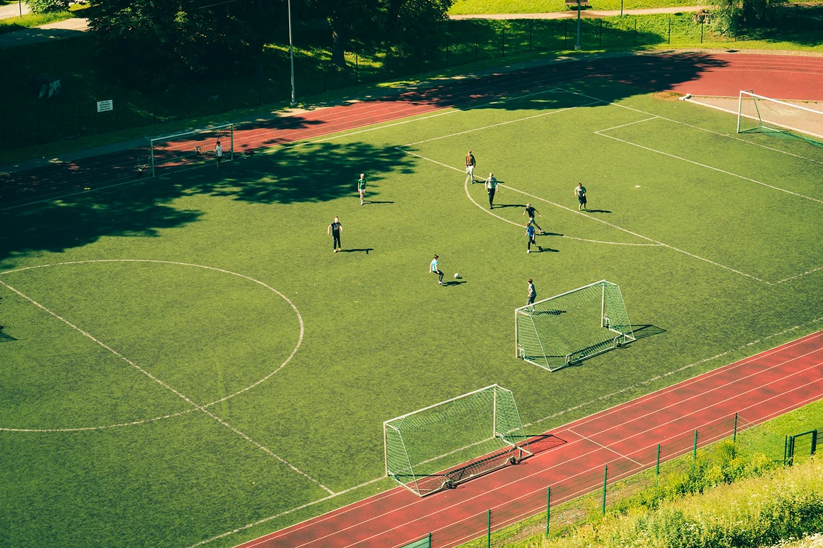 Players on an outdoor artificial-turf soccer field
