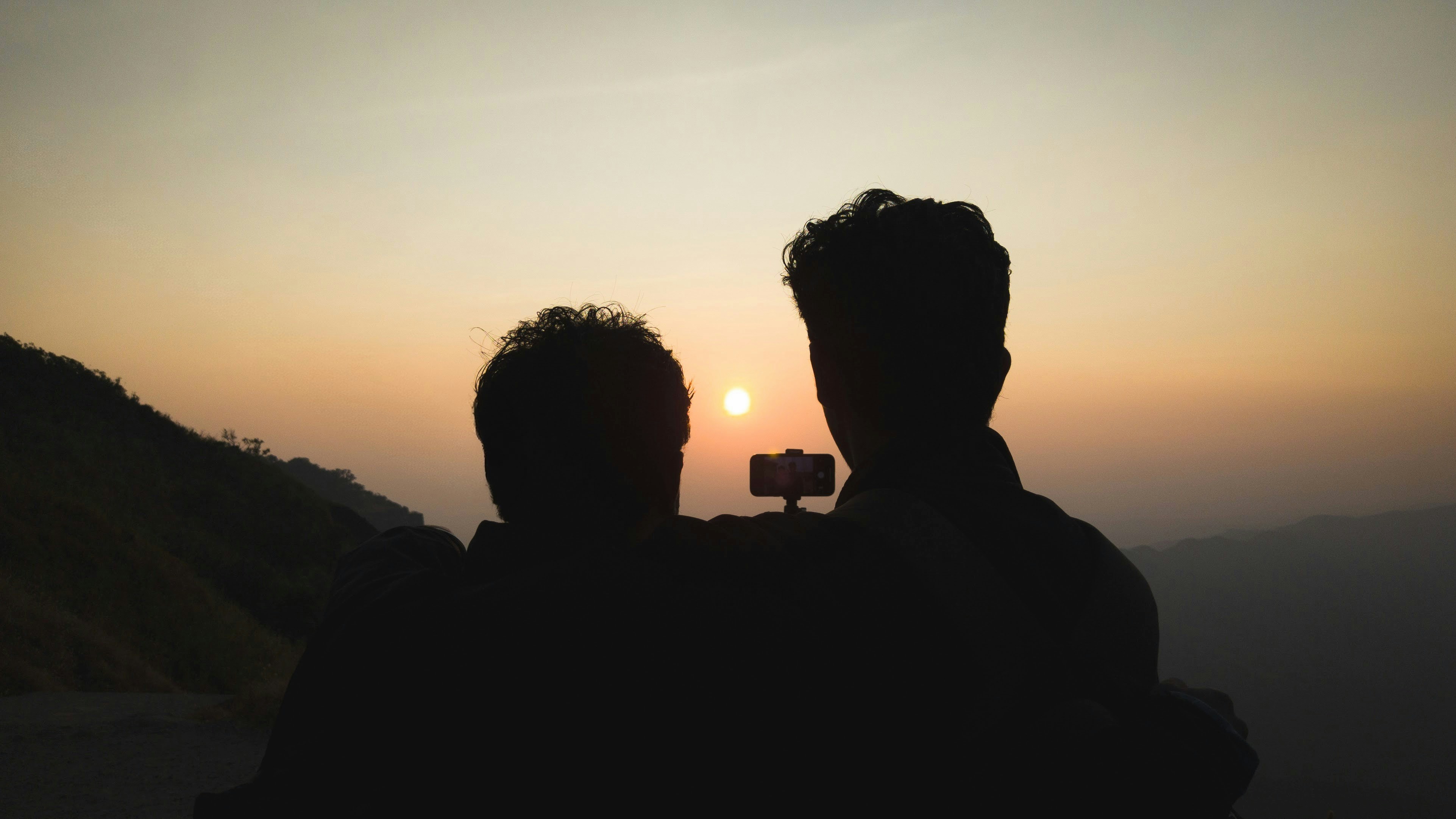 A couple of men standing next to each other