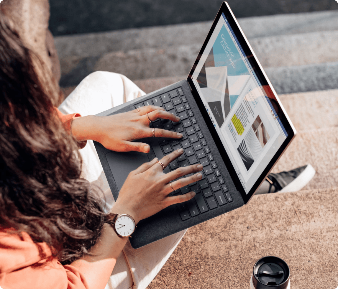 A woman is working on a laptop