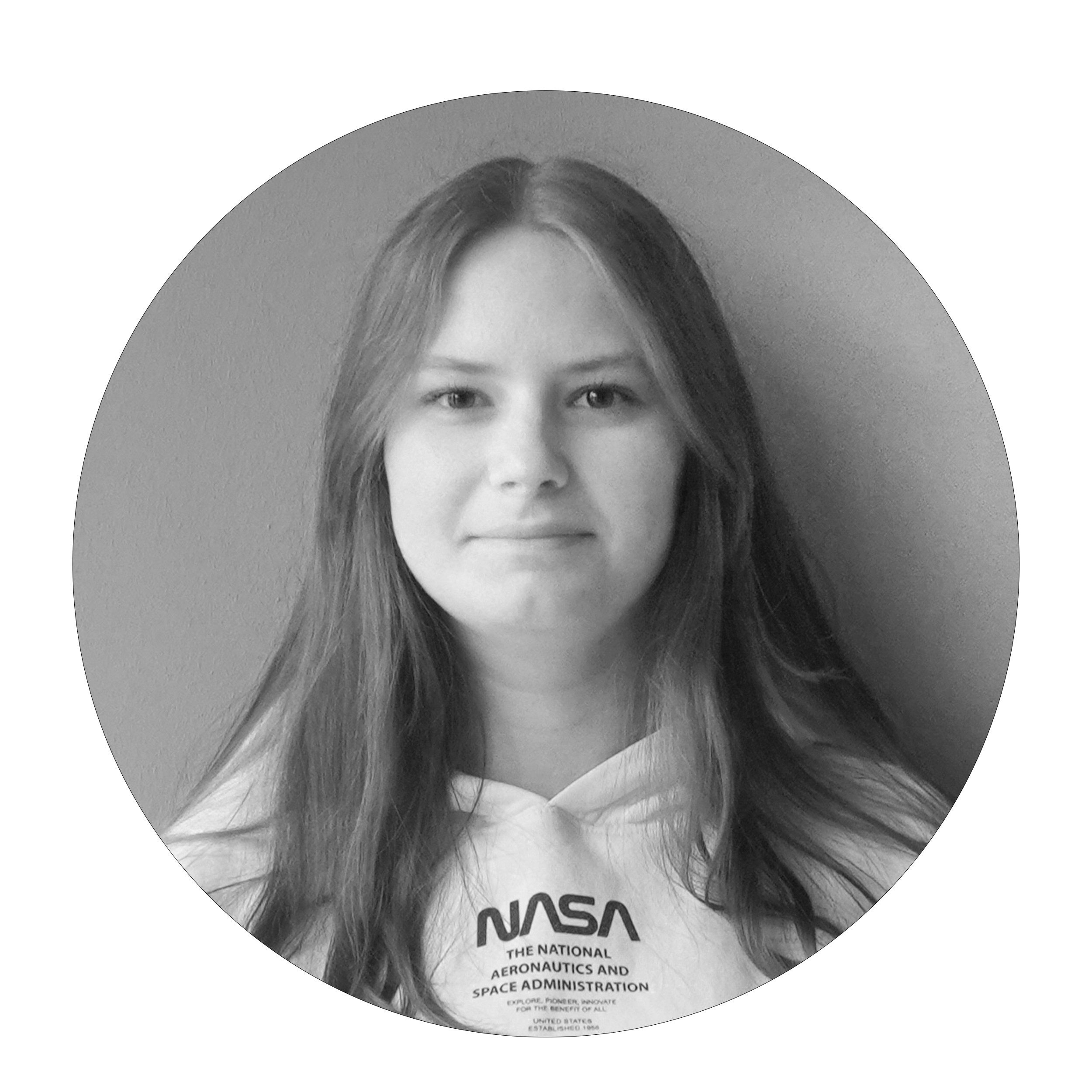 Portrait of a young woman wearing a NASA hoodie, in black and white.