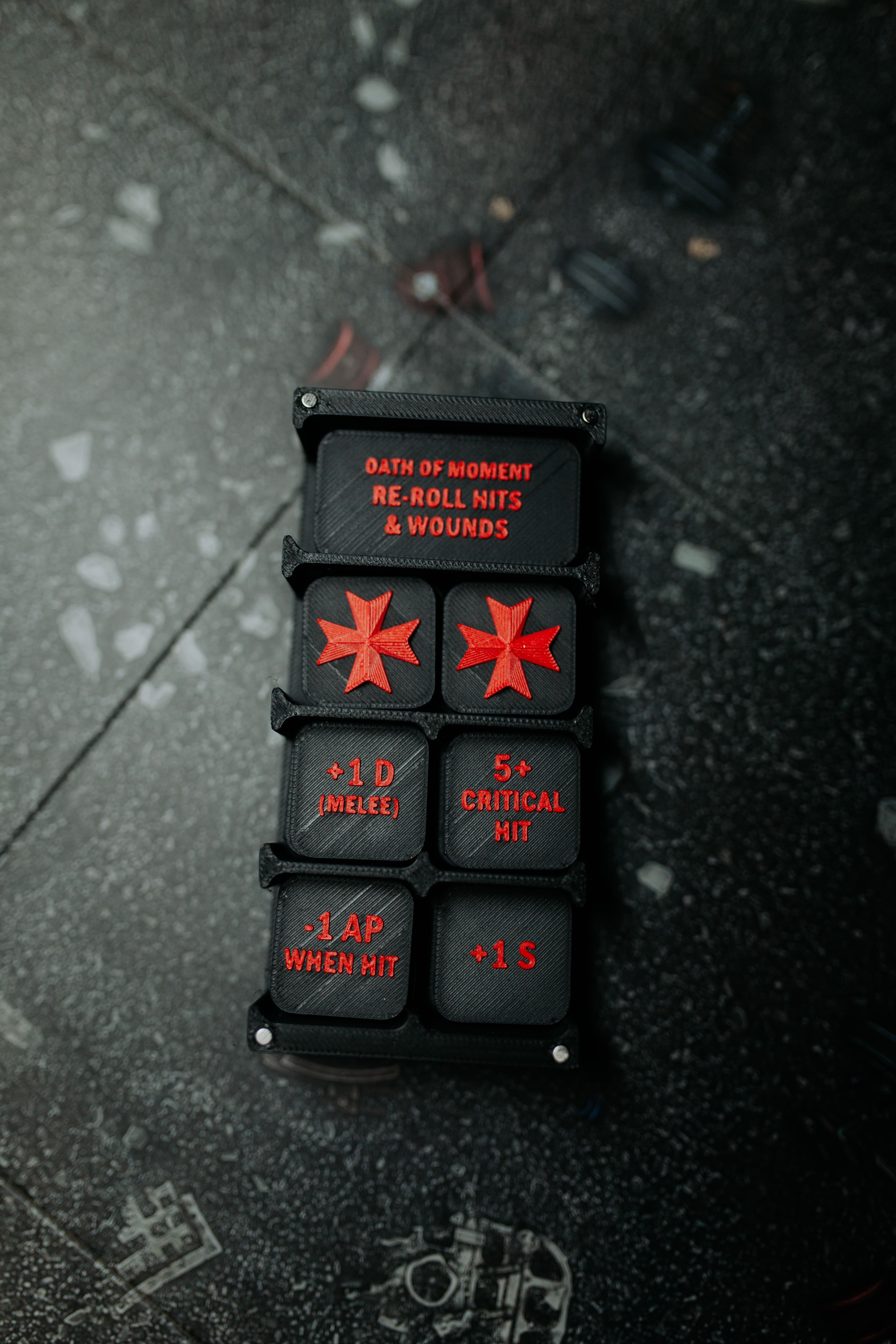 Templar brother tokens in black and red in a box