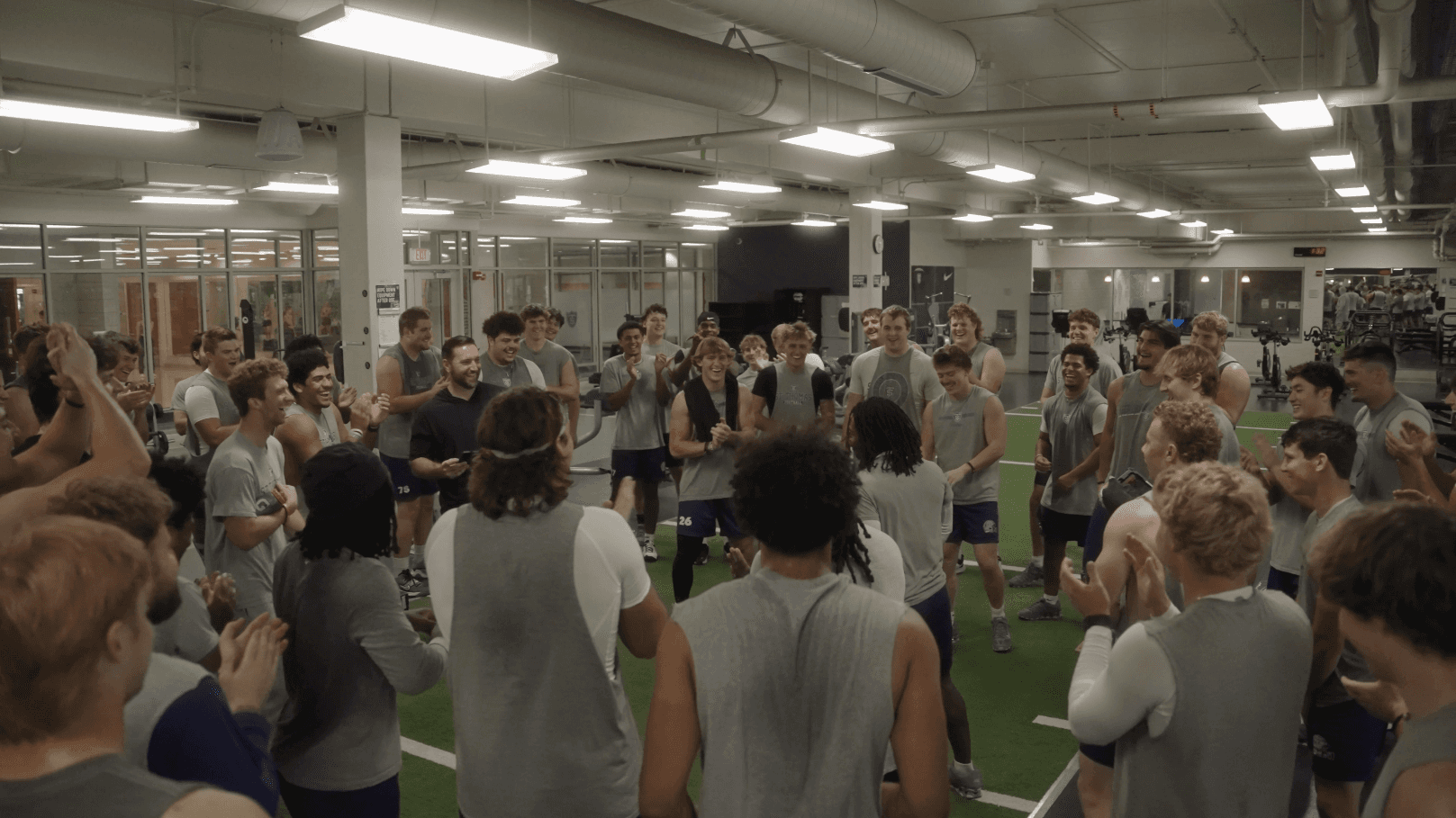 a group of people playing a game of ice hockey