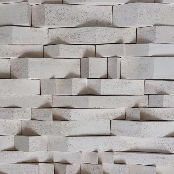 A creative 3D travertine wall design with varying depths, offering a unique textured feature for modern interiors.