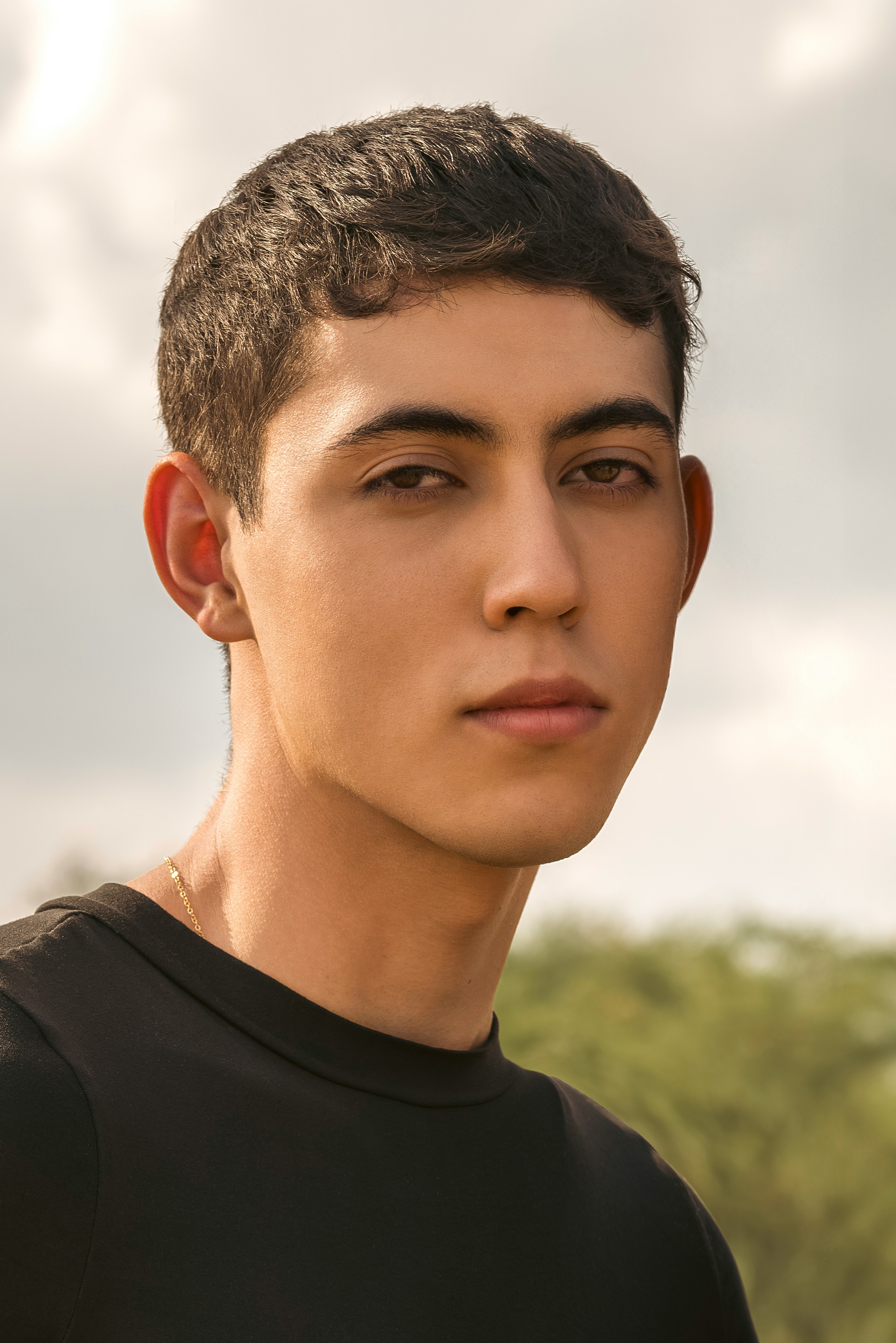 A close up of a person wearing a black shirt
