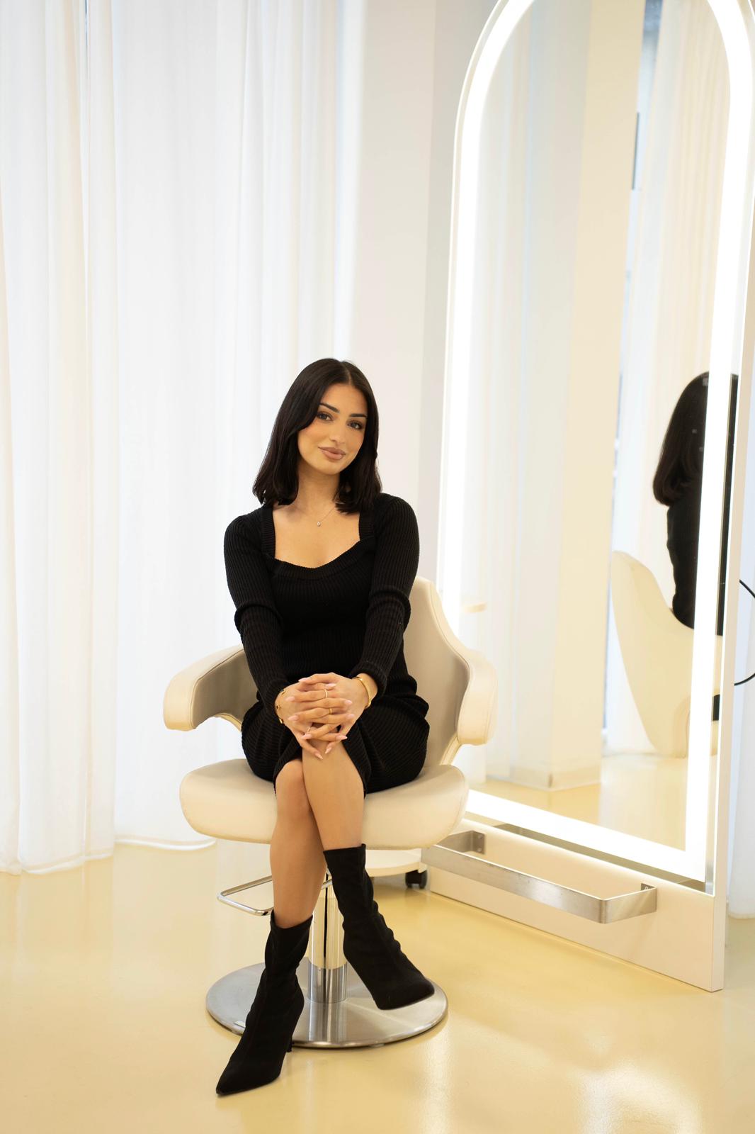 person sitting in a chair in front of a man