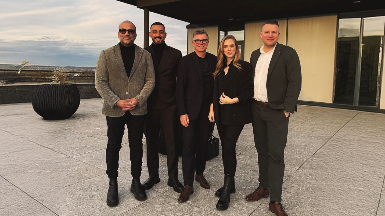 Large outdoor billboard amid trees, showing a purple-to-peach gradient background with the white text “Your mental health, simplified.” and a small purple gradient pill-shaped logo above the word “Circular.”