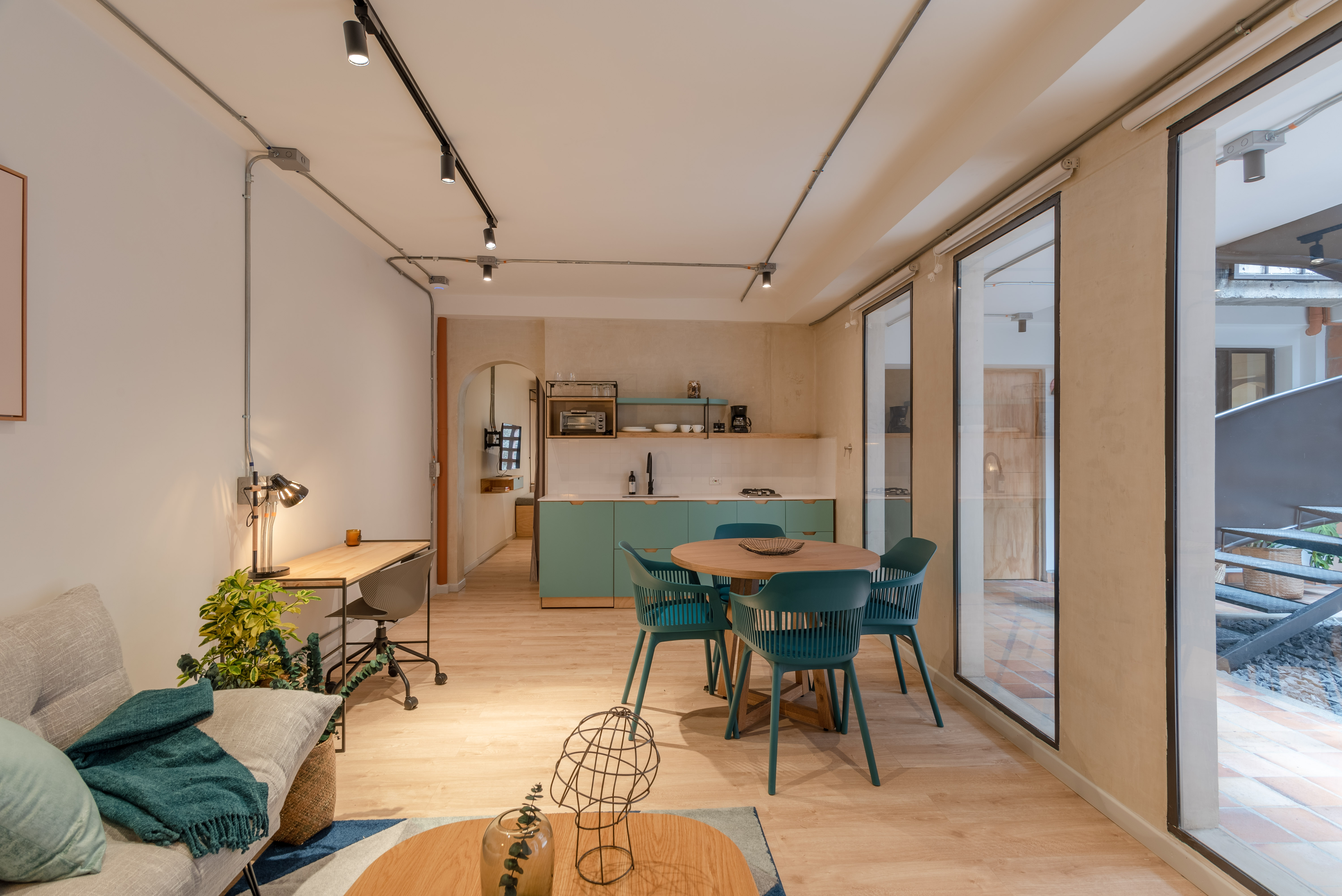 Double-height interior with flowing sculptural forms and warm raking light