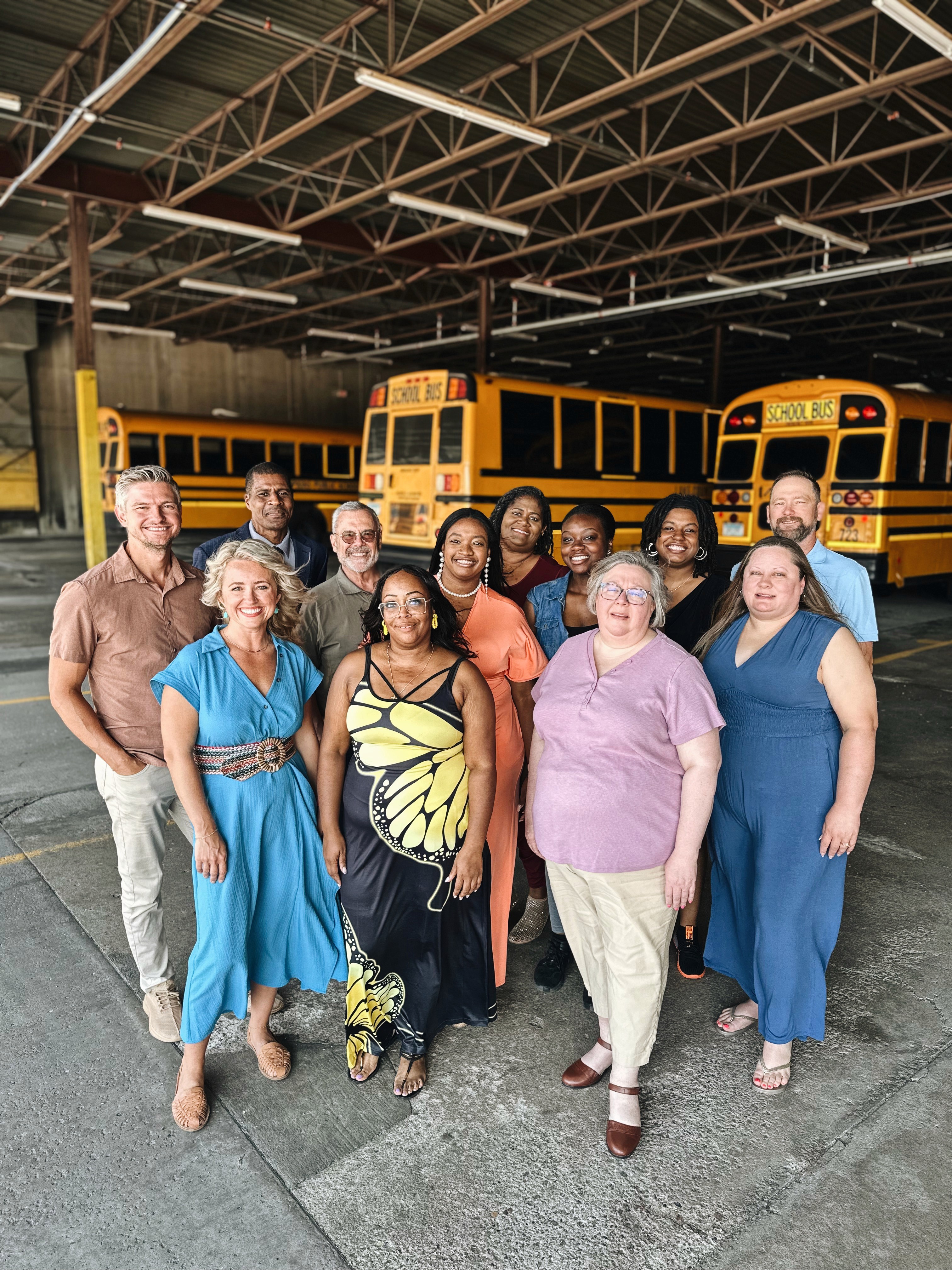 three women sitting beside wooden table