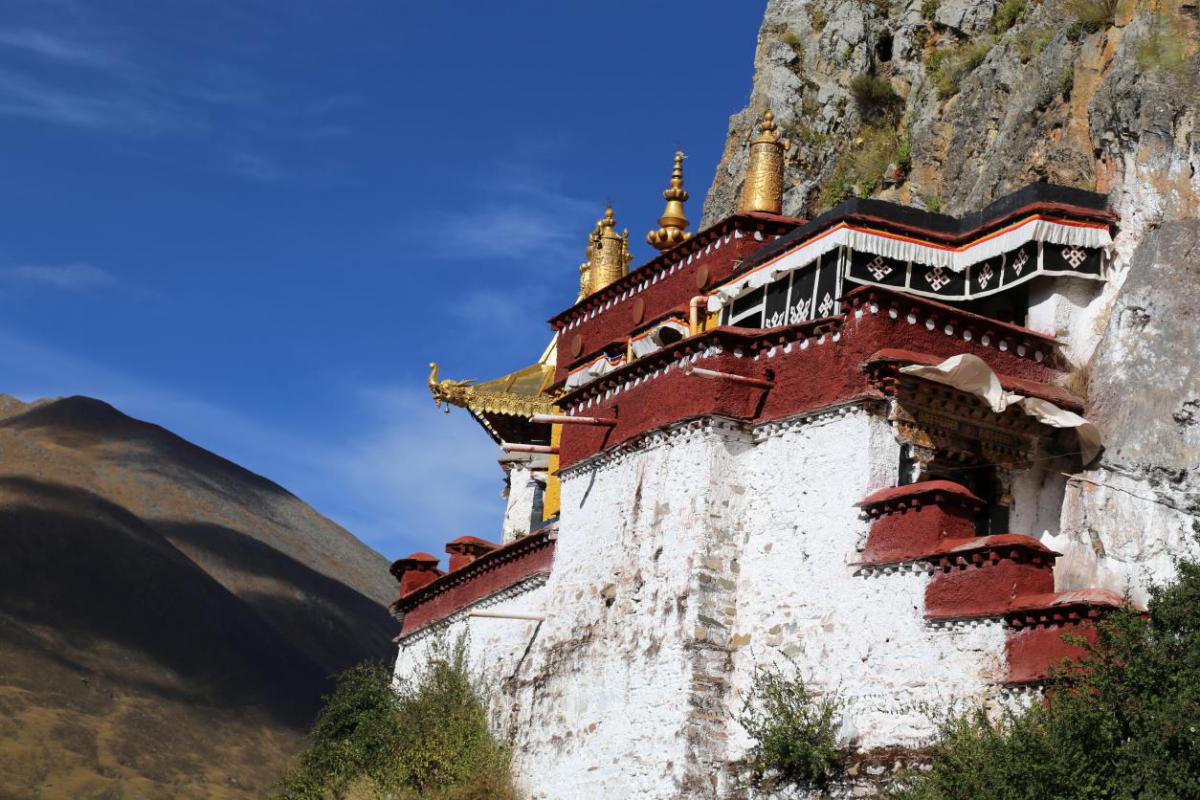 blue lake in the middle of rocky mountains