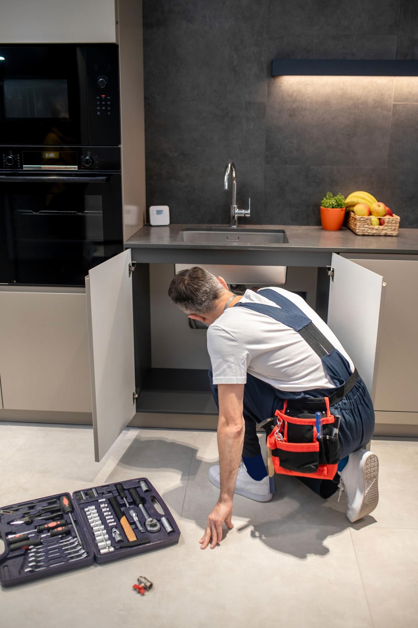 A team of professionals installing a custom kitchen