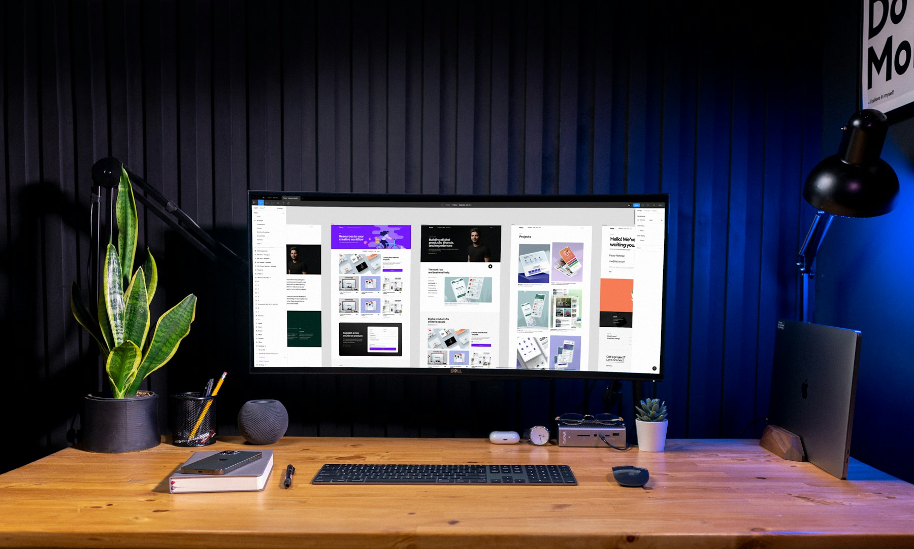 A desktop display showing a considered website inside a creative workspace.