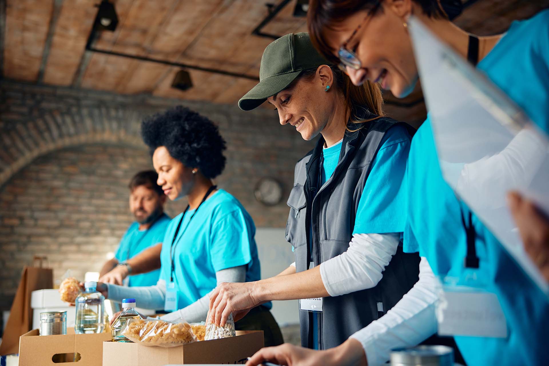 APAP volunteers packing food and essential supplies for people facing homelessness.