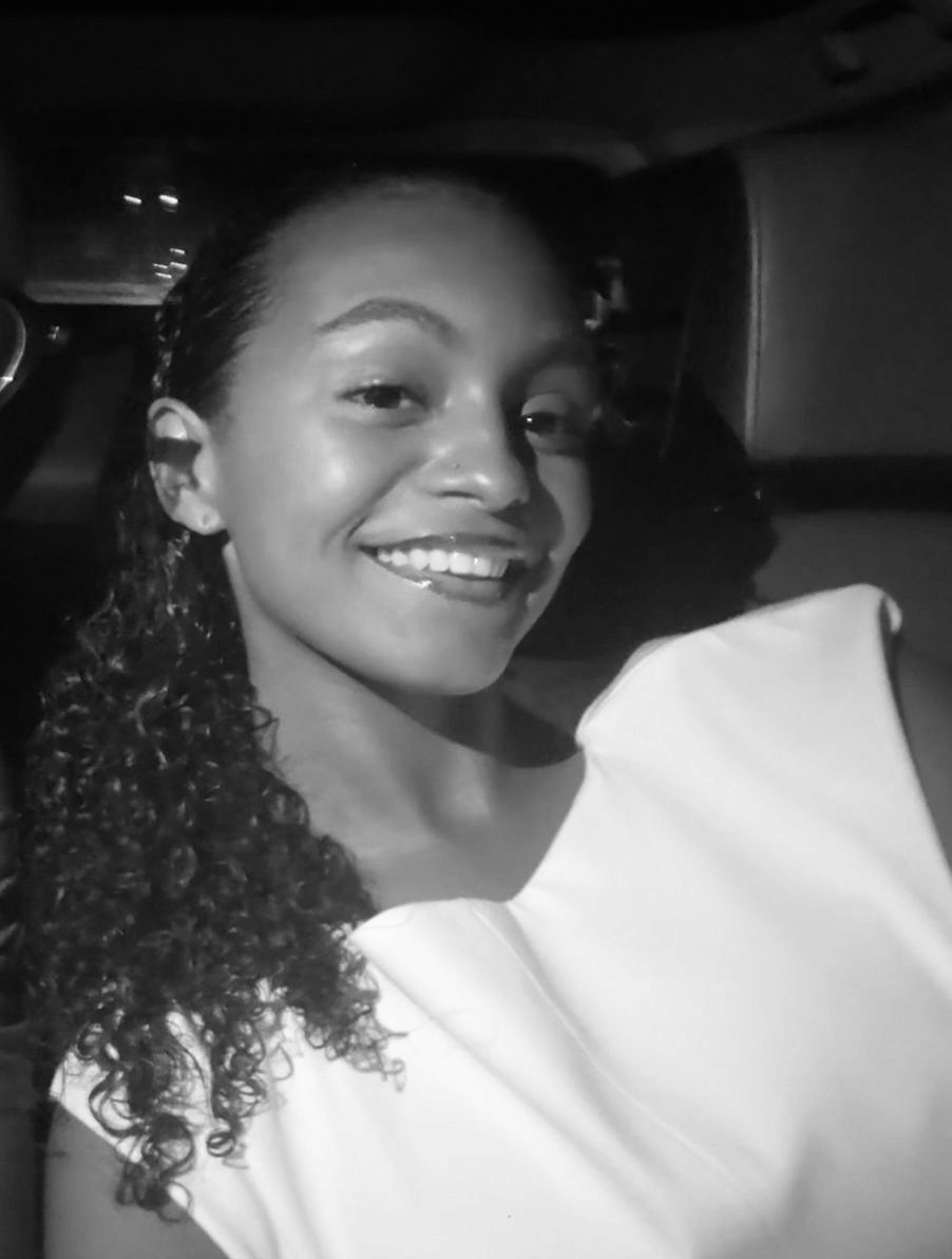 woman in white crew neck shirt smiling