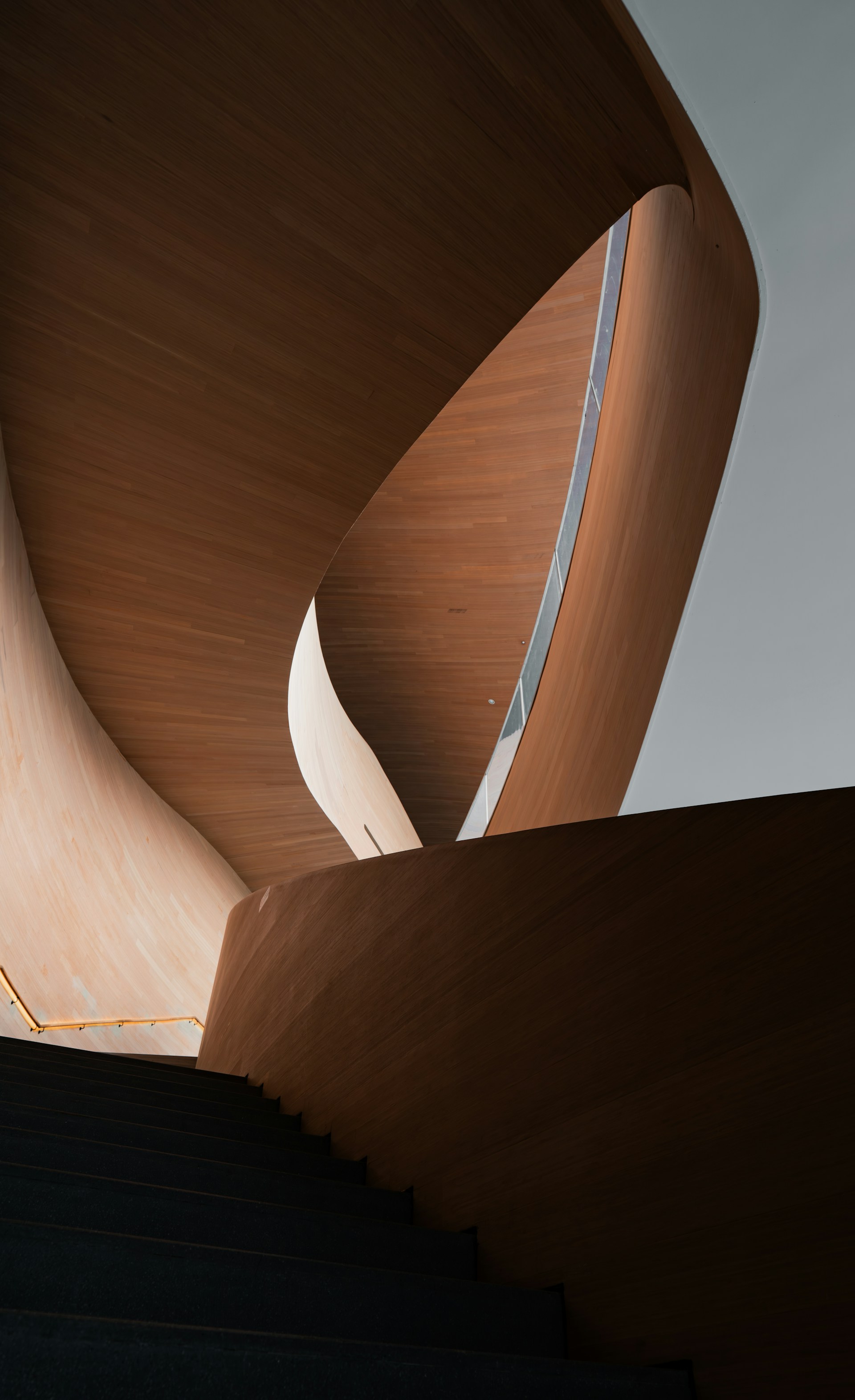 Modern wooden staircase with abstract architectural design