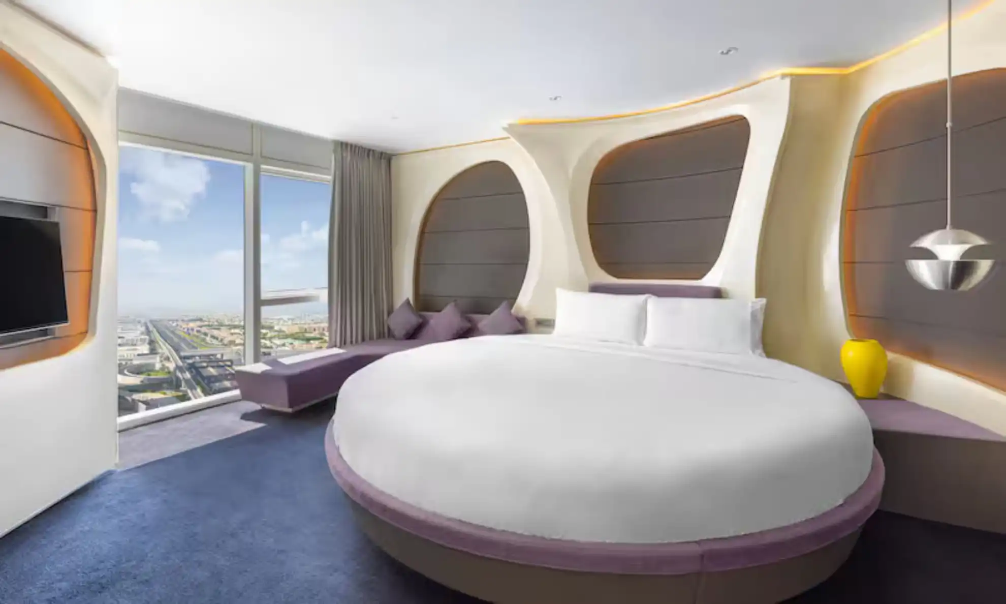 A guest room with a circular bed at V Hotel Dubai, a pet-friendly hotel in Al Habtoor City