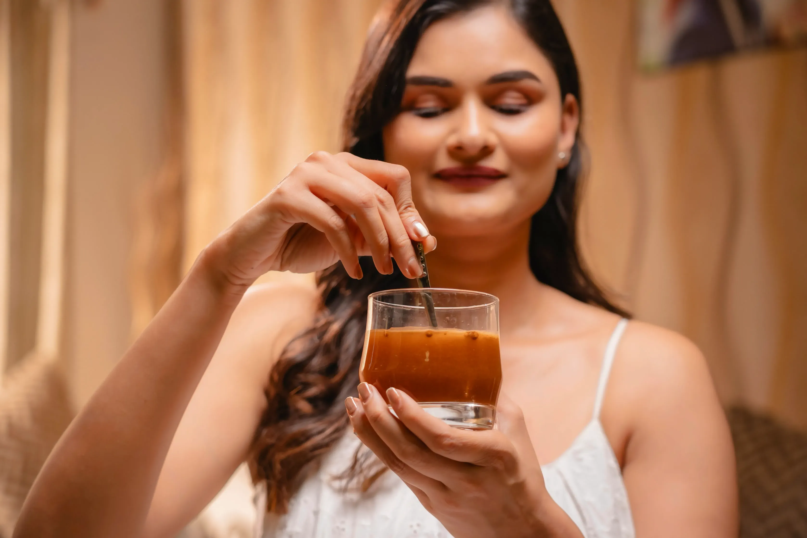 Portrait of woman holding Bionii product against clean background