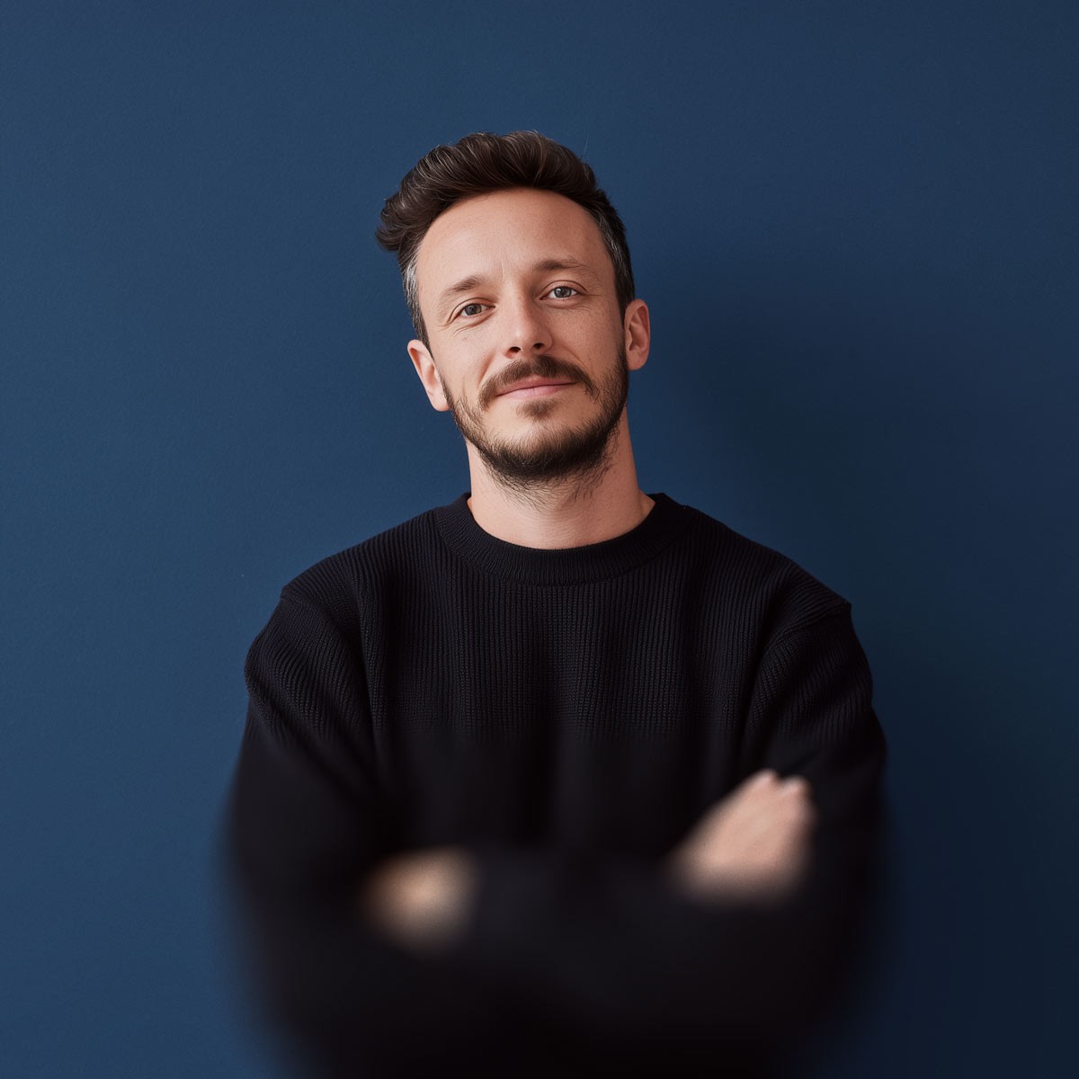 Team member portrait on blue background