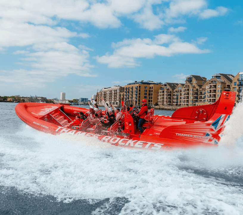 Thames Rockets Speedboat Experience: The sleek red Thames Rocket RIB speeds down the Thames.