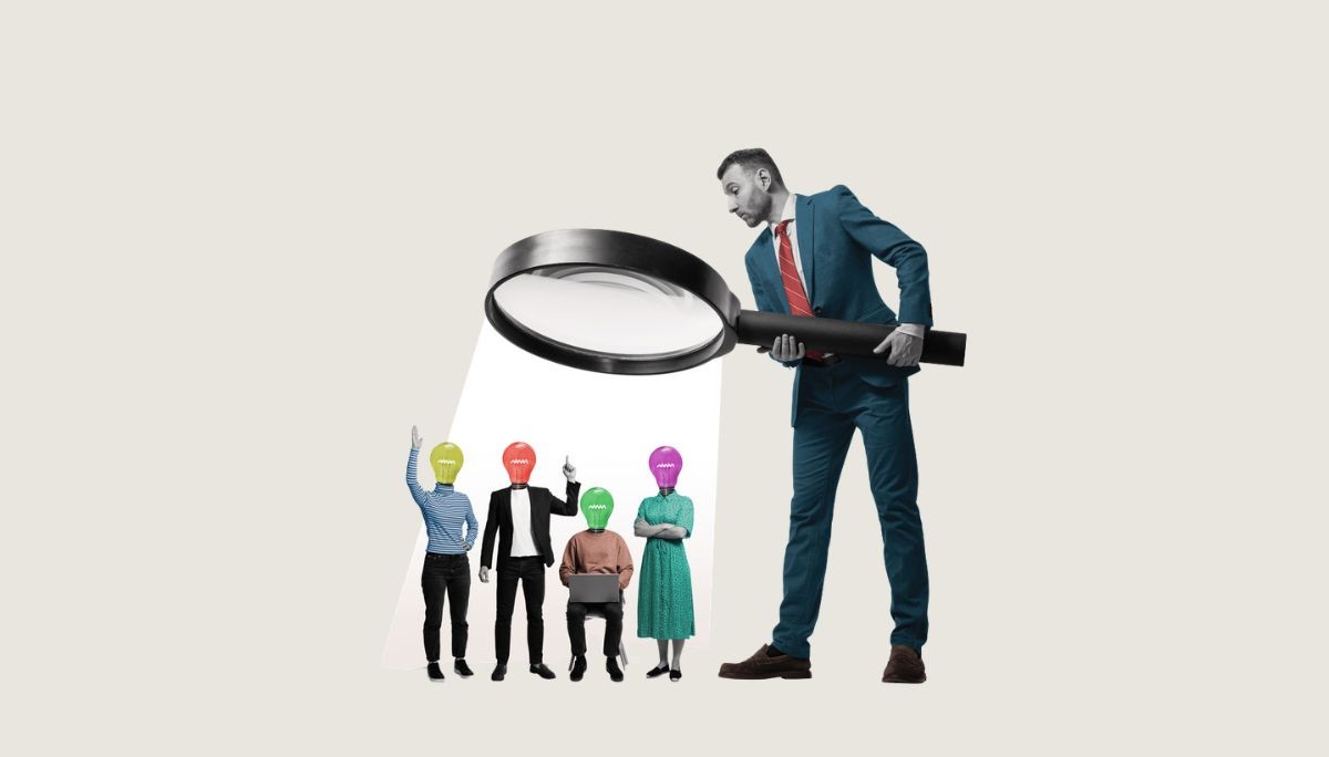 Illustration of a businessperson using a magnifying glass to examine figures with lightbulb heads, symbolizing startup recruiting and fast hiring.
