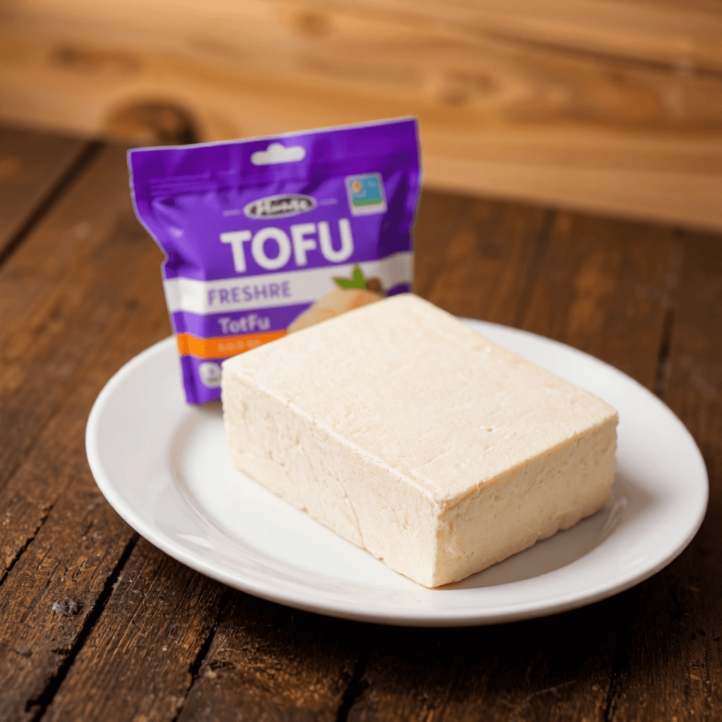 product photography of a package of tofu, used for cooking and as a protein source, featuring a block of tofu on a plate