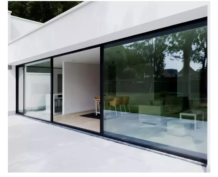 Interior of an architect-designed living room with floor-to-ceiling glass
