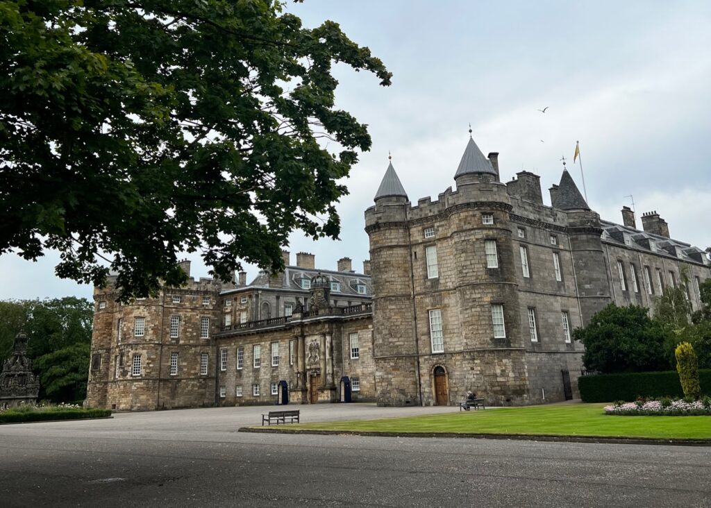 Holyrood palace and its front grounds in Edinburgh.