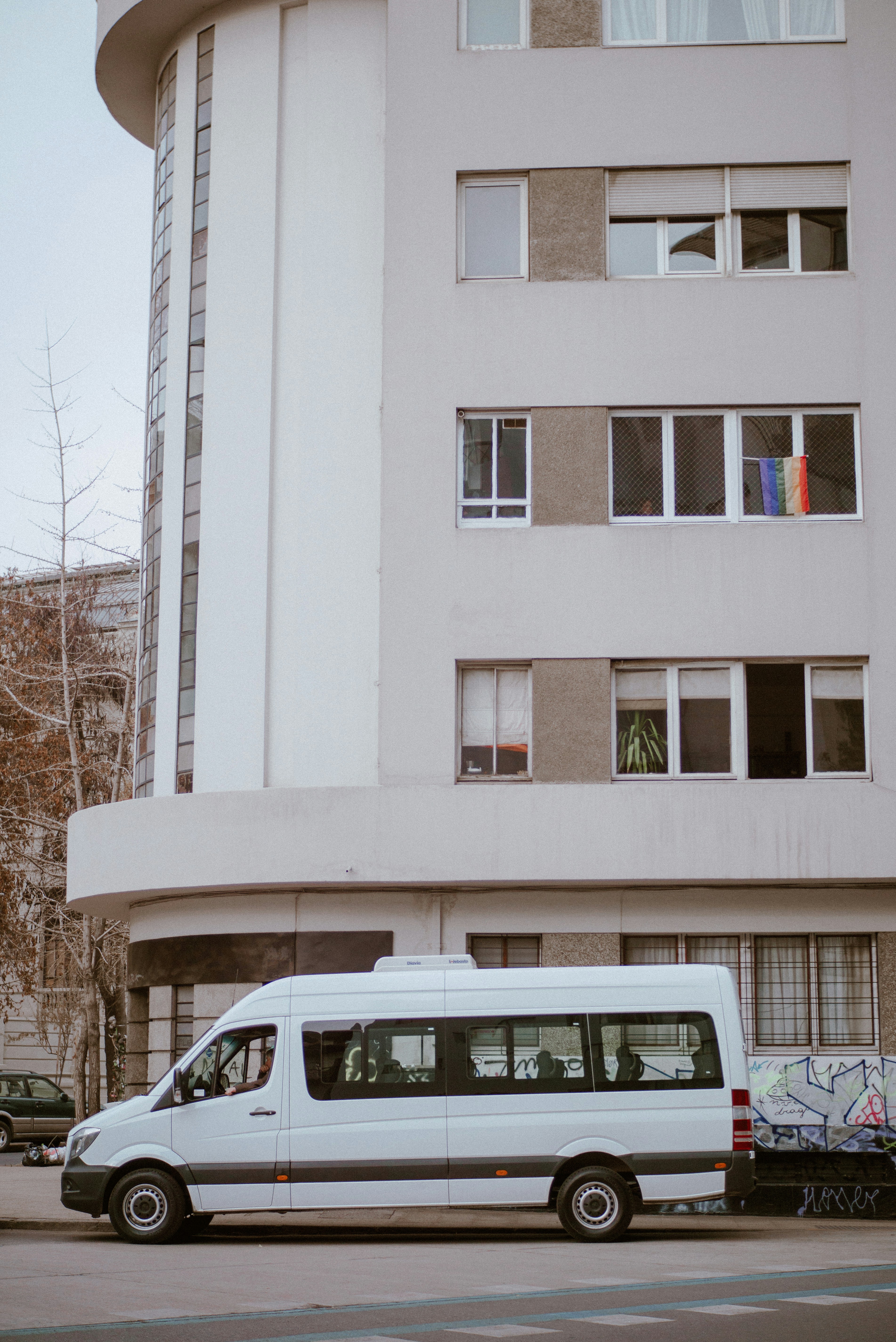 Mini bus parked outside a building.