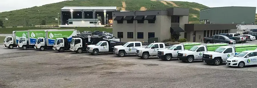 Photo of Quality Waterproofing fleet in front of Valley Park headquarters