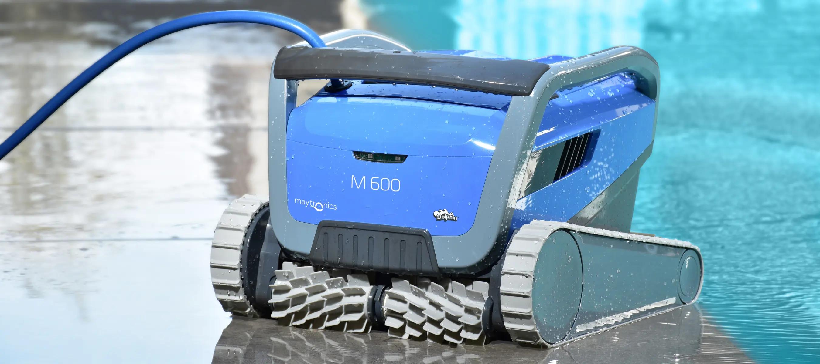 The dolphin m600 product shot next to a pool